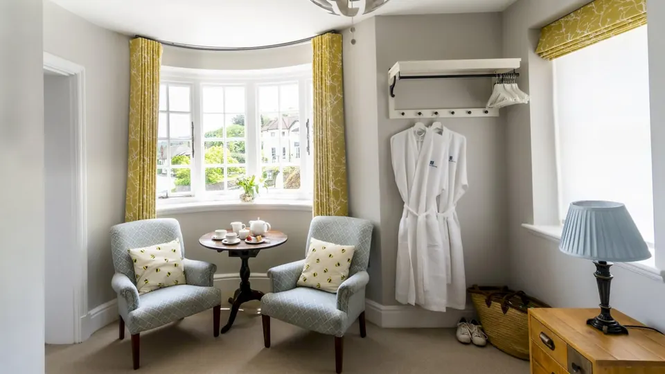 Bay-window sitting area in a guest room at The Porlock Weir Hotel