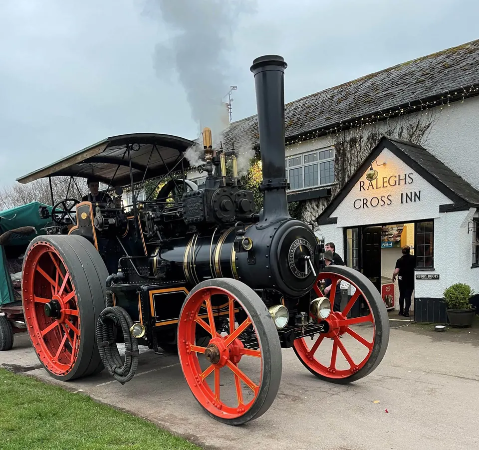 Ralegh’s Cross Inn entrance with a traction engine outside